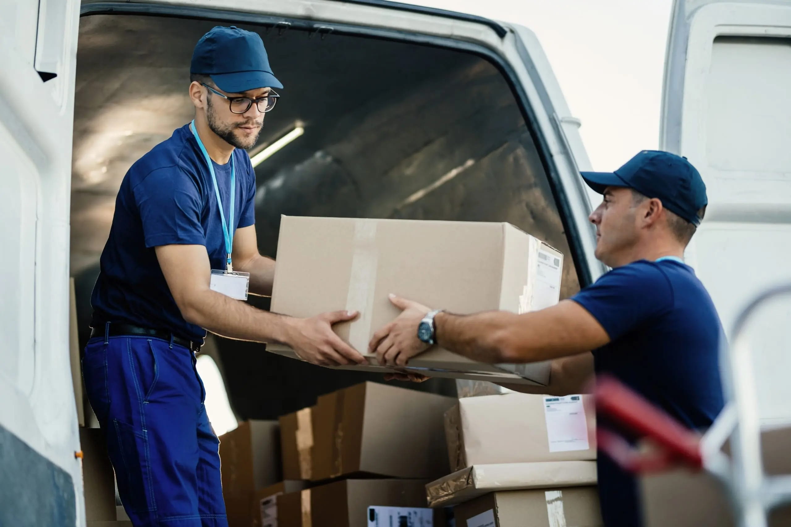 Movers delivering furniture to a residential property